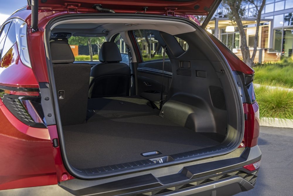 Cargo bay of 2022 Hyundai Tucson with rear seats partially folded