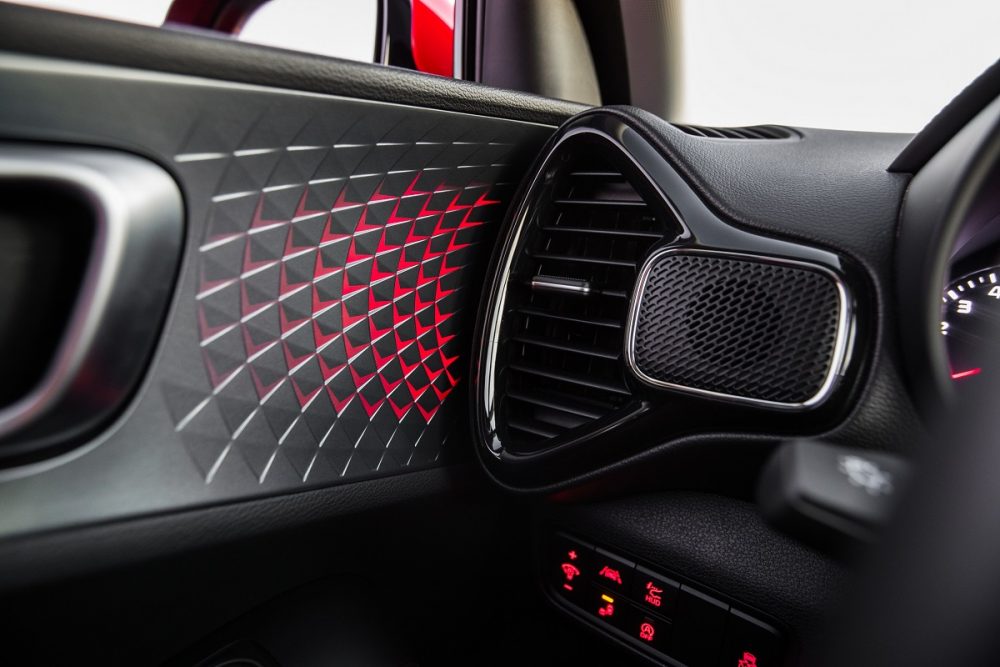 Interior photo of 2022 Kia Soul driver's side air vent, showing red lighting