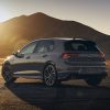 Rear exterior view of the 2022 Volkswagen Golf GTI parked with mountains behind