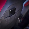 Close up of the interior seatback pocket of the 2022 Volkswagen Golf GTI with a smartphone in the pocket