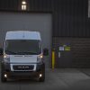 The 2022 Ram ProMaster 2500 in front of a garage door