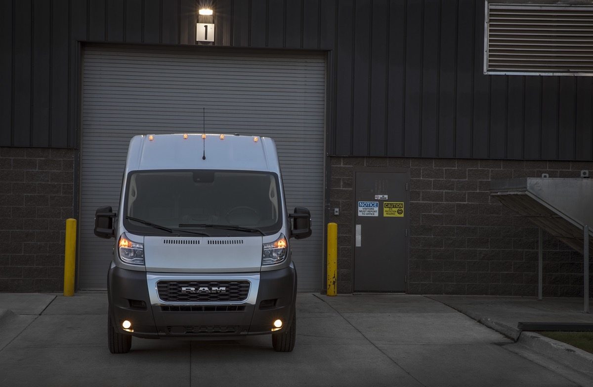 The 2022 Ram ProMaster 2500 in front of a garage door