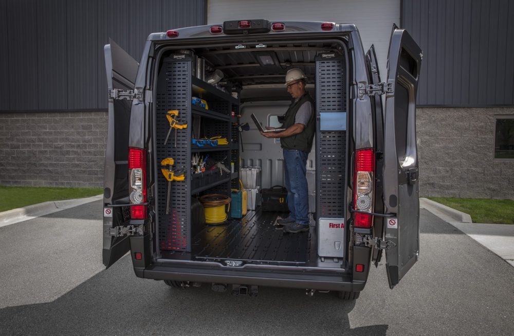 The 2022 Ram ProMaster 3500 with the backdoors open and a worker inside