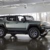 Side exterior view of the 2024 GMC Hummer EV SUV