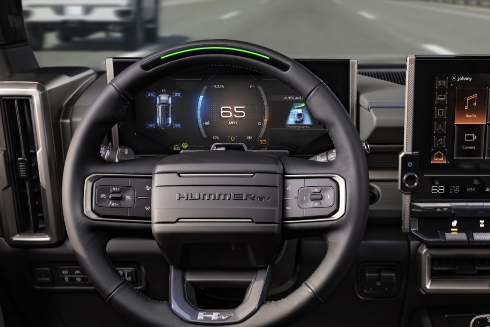 Close up of the steering wheel and driver information center in the 2024 GMC Hummer EV SUV