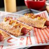 Three delicious(?) Apple Pie Hot Dogs, which will be served at the MLB Field of Dreams game on Aug. 12