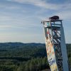 A Ford Explorer Plug-In Hybrid rests atop the OVER climbing tower in Norway, the tallest free-standing climbing structure on Earth