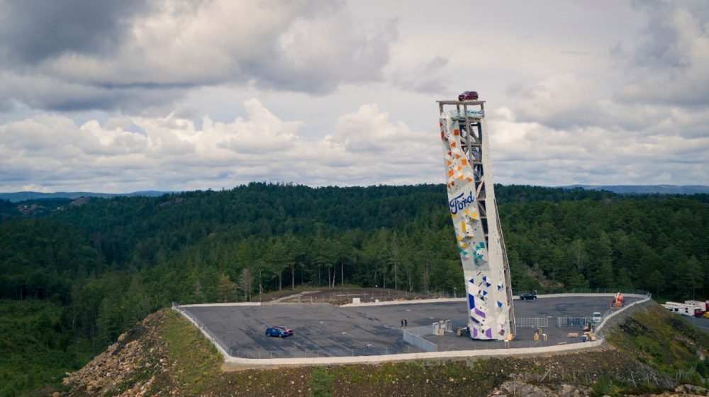 A Ford Explorer Plug-In Hybrid rests atop the OVER climbing tower in Norway, the tallest free-standing climbing structure on Earth