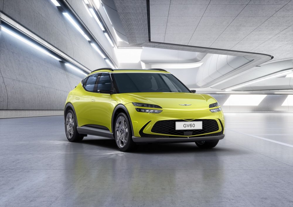 Front side view of yellow-green Genesis GV60 electric crossover