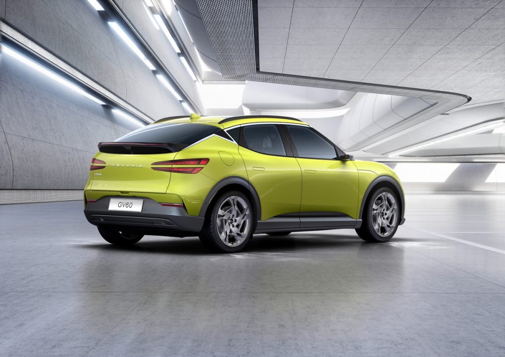 Rear side view of yellow-green Genesis GV60 electric crossover