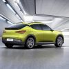 Rear side view of yellow-green Genesis GV60 electric crossover