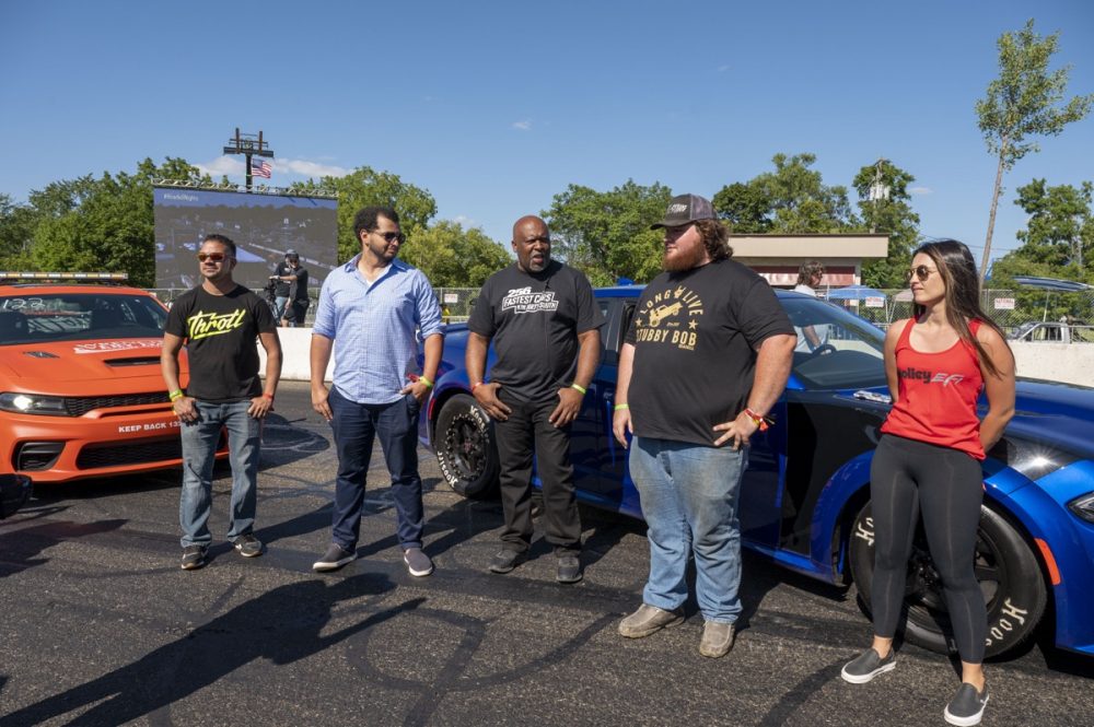 The Hellcat Grudge Race competitors in front of a car