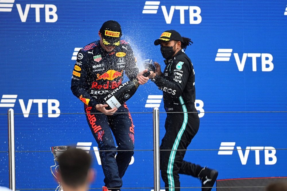 Lewis Hamilton sprays Max Verstappen with champagne on 2021 Russian Grand Prix podium