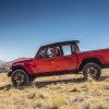 The 2021 Jeep Gladiator with half doors driving off the road