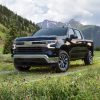 2022 Chevrolet Silverado LT Front Side View, in front of a mountain