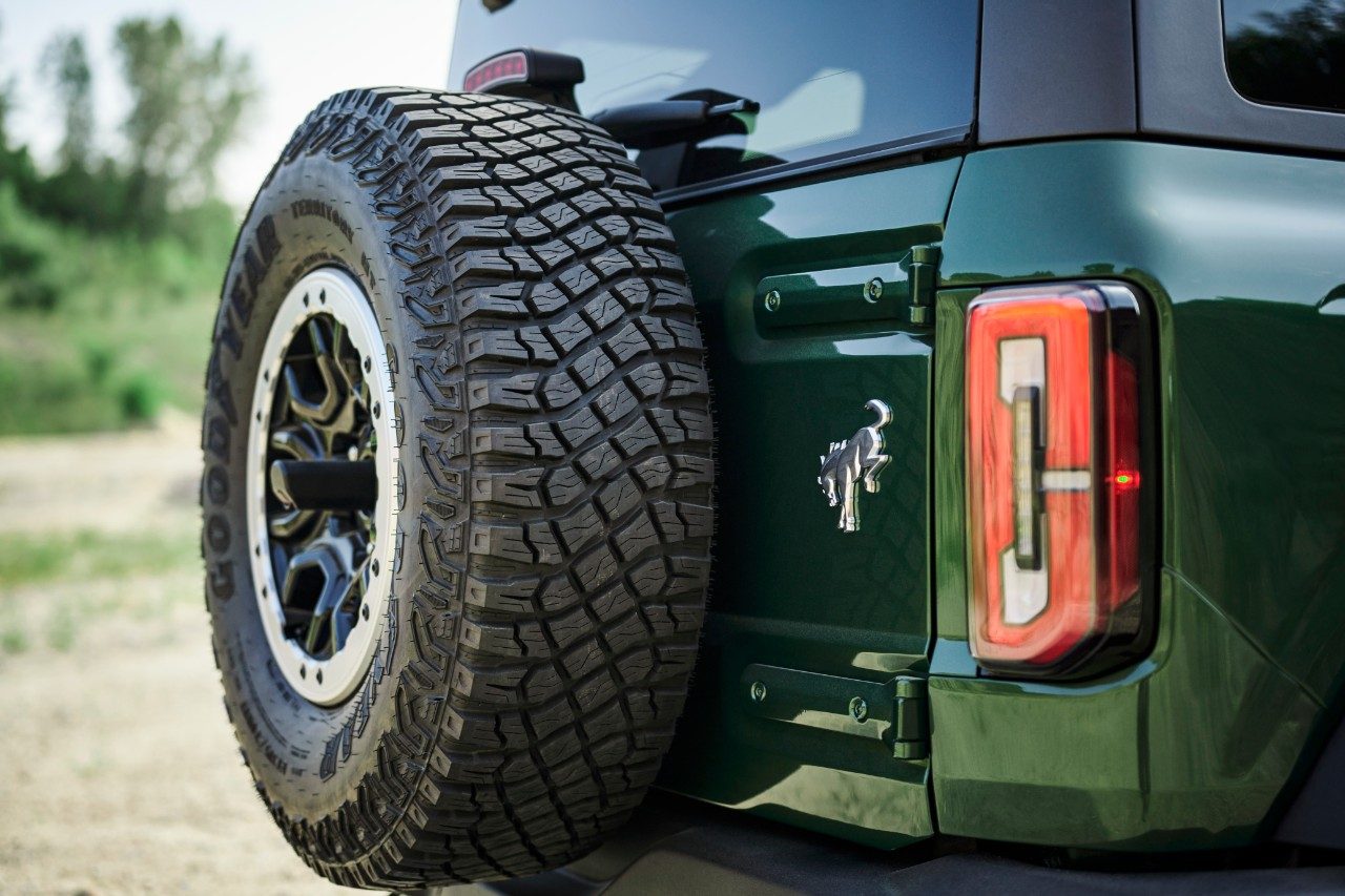 Rear mounted tire of a 2022 Ford Bronco four-door in Eruption Green