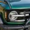 Headlight and grille view of 2022 Ford Bronco four-door in Eruption Green