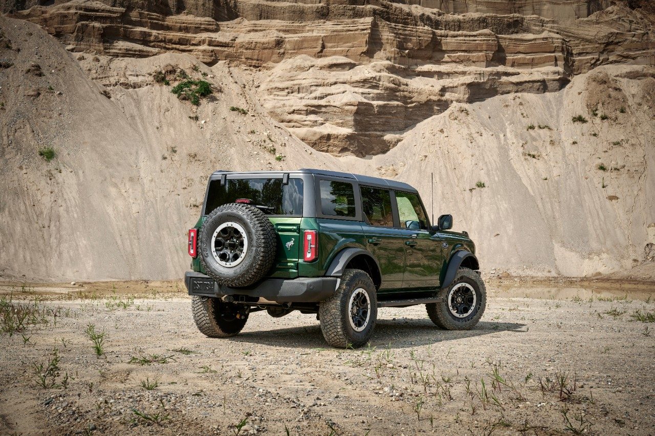 Rear quarter angle of 2022 Ford Bronco four-door in Eruption Green