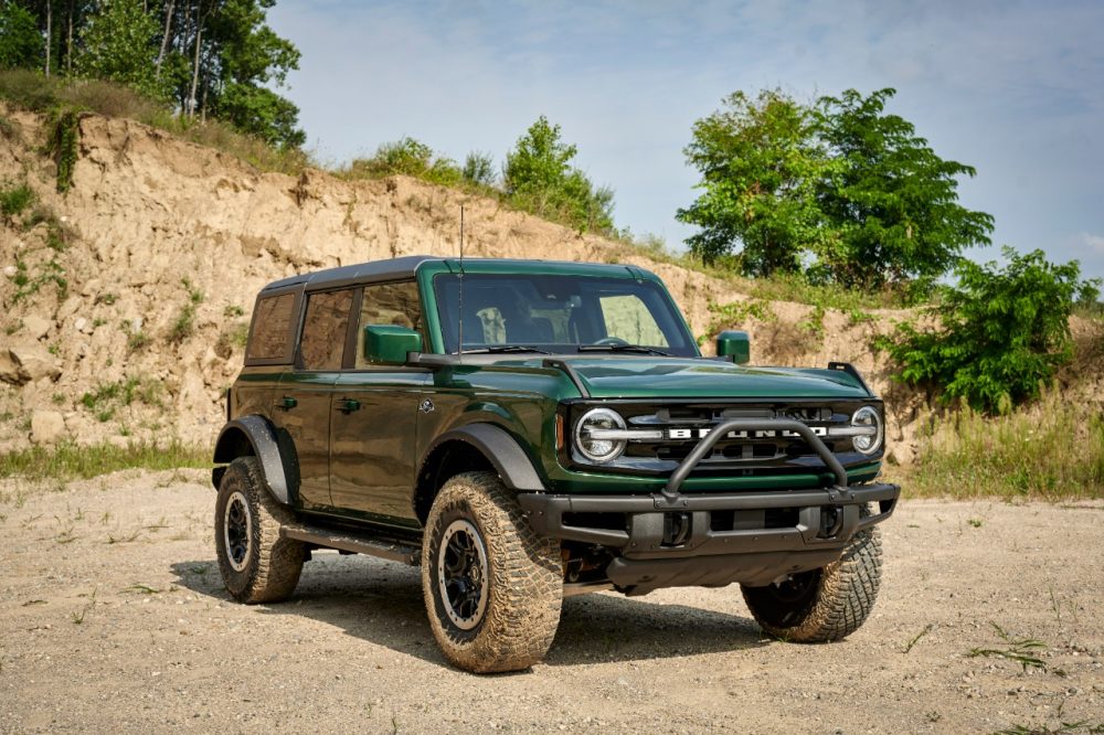 Front right quarter angle of 2022 Ford Bronco four-door in Eruption Green