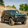 Front right quarter angle of 2022 Ford Bronco four-door in Eruption Green