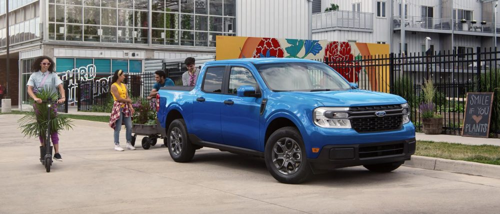 2022 Ford Maverick with young professionals loading FlexBed with garden goods