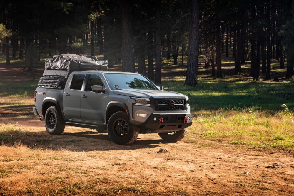 Grey 2022 Nissan Frontier with bed rack on top  at Overland Expo West