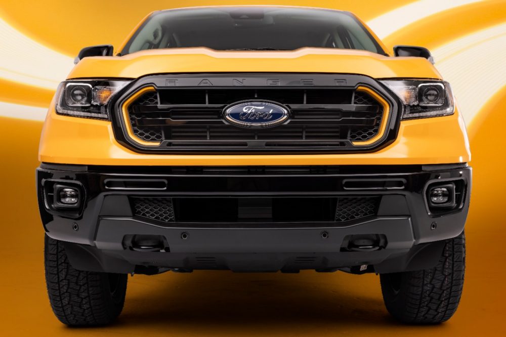 Front grille view of a 2022 Ranger Splash Package on a Cyber Orange Lariat CrewCab with optional FX4 Package