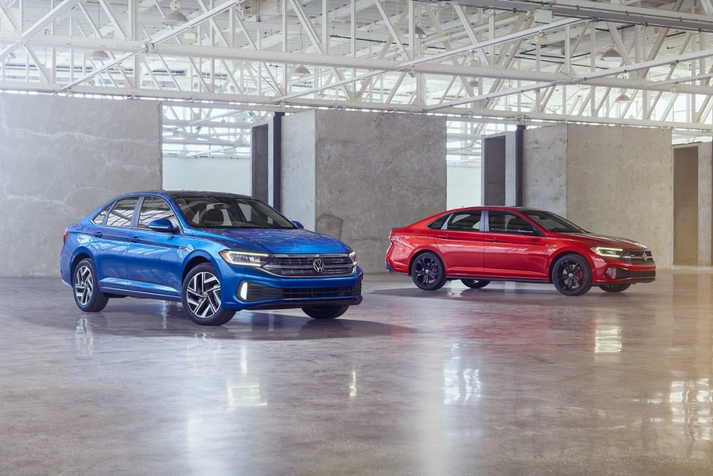 Front side view of a blue 2022 Volkswagen Jetta and a red 2022 Volkswagen Jetta GLI