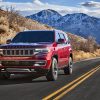 Front view of the 2022 Wagoneer on a highway in a mountain range