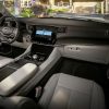 Interior view of the front seat area in the 2022 Wagoneer, showcasing the steering wheel and dash