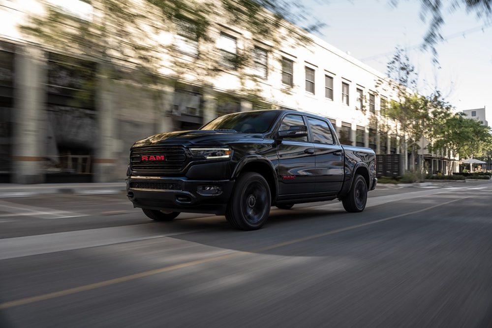 The 2022 Ram 1500 (RAM)RED Edition driving on the street