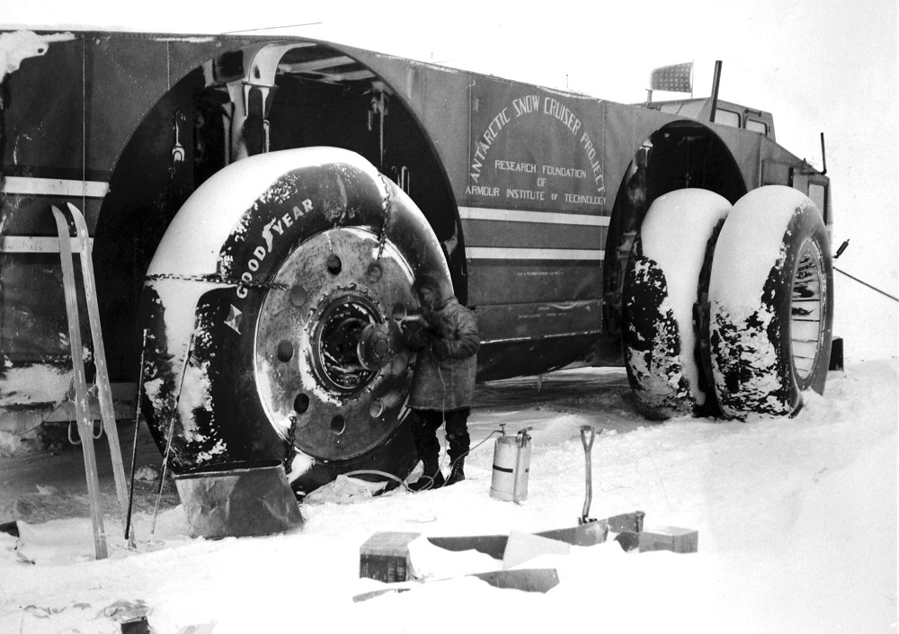 Antarctic Snow Cruiser engineers clear its snow-encrusted wheels