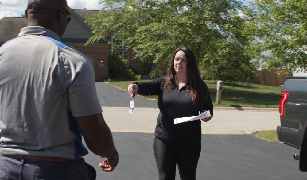 A Ford dealership employee drops the keys off during a Pickup & Delivery service