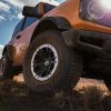 Front wheel angle of Ford Bronco two-door in Cyber Orange