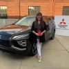 Mel Taylor standing in front of her 2022 Eclipse Cross