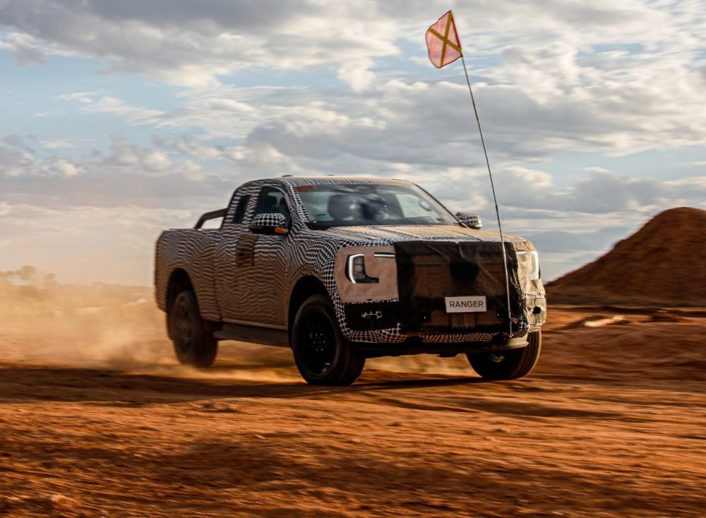 Next-generation Ford Ranger in camouflage driving through a desert