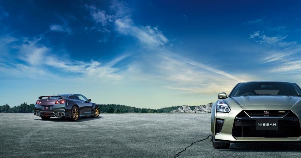 Nissan GT-R T-spec edition parked on blacktop with a blue sky in the background