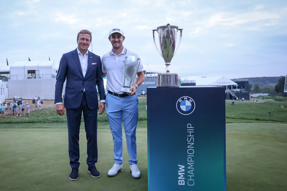 BMW Chairman Oliver Zipse poses with 2021 BMW Championship winner Patrick Cantlay