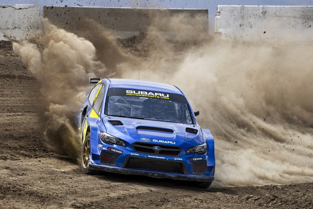 Subaru WRX STI Rallycross Car Drives on a Dirt Path