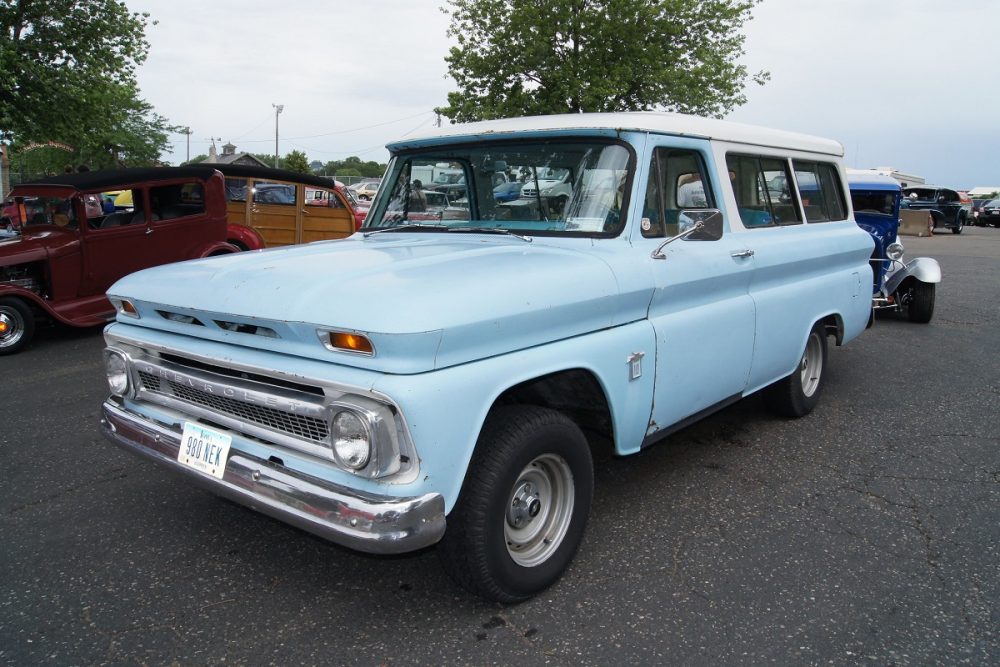 Front angled view of a light blue 1964 Chevrolet Suburban Carryall