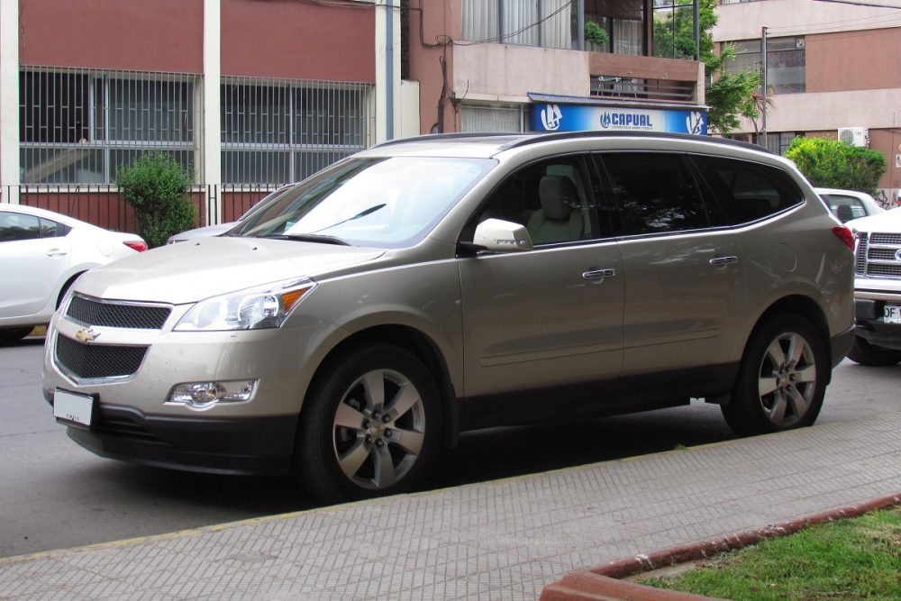 Front side view of a silver 2011 Chevrolet Traverse LT