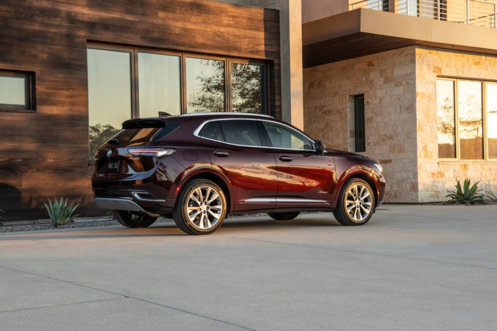 2022 Buick Envision parked in front of a building with reflective windows