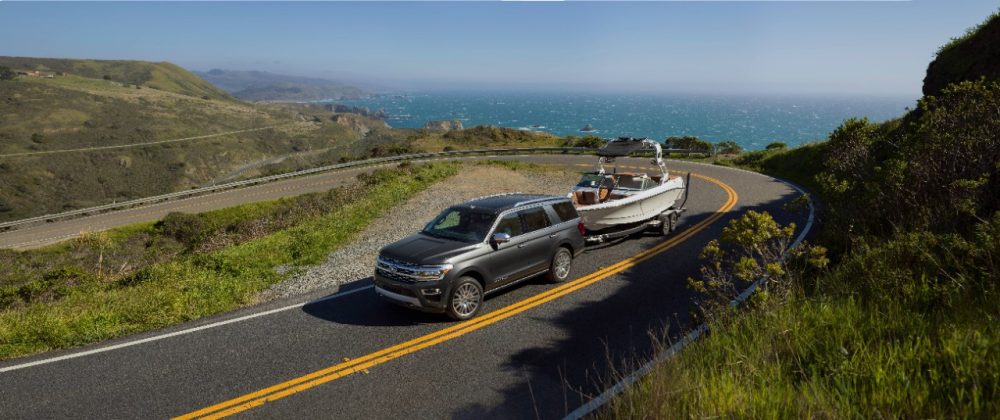 2022 Ford Expedition Platinum in Dark Matter towing a boat