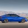 Side profile view of blue 2022 Hyundai Elantra N Line with mountains in background