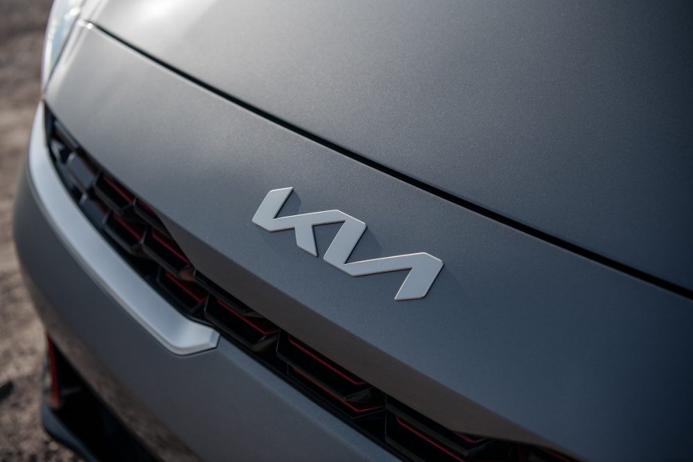 Close up of the Kia logo on the 2022 Kia Forte hood