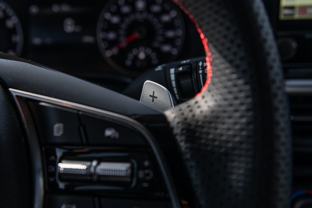 Close up of the 2022 Kia Forte steering wheel and paddle shifters