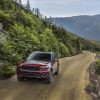 The 2022 Jeep Grand Cherokee Trailhawk driving on a sandy road