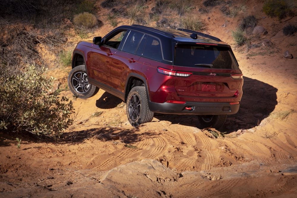 The 2022 Jeep Grand Cherokee Trailhawk driving on sand