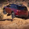 The 2022 Jeep Grand Cherokee Trailhawk driving on sand