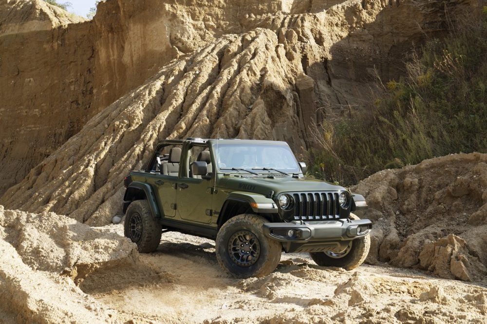 The 2022 Jeep Wrangler Willys with the Xtreme Recon Package driving on a sandy path